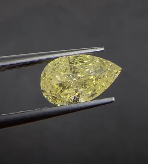 Natural Fancy Yellow Diamond, pear cut 1.11 Carat (Slightly included)