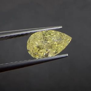 Natural Fancy Yellow Diamond, pear cut 1.11 Carat (Slightly included)